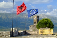 Flags of Albania and Gjirokaster Castle, Albania