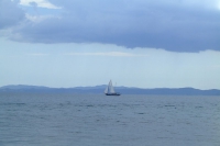 Small sailboat in Corfu Channel